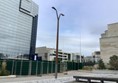 Our photo shows the ramp available above brown brick work, that will get you down to lower level for hotel entrance, OR BETTER STILL, when you get off the tram, opposite the station, and in between the Hyatt hotel and next building