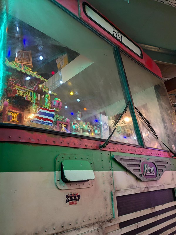 Image of  a bus window with toys and lights