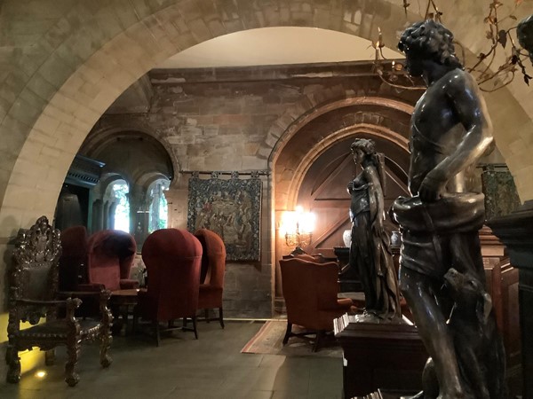 Picture of statues in a corridor with an arched ceiling