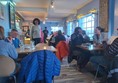 Image of a group of people sitting at tables in a restaurant