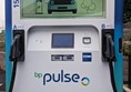 Image of  a white and blue electric vehicle charging station