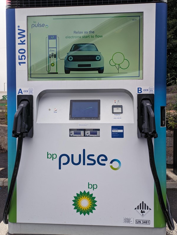 Image of  a white and blue electric vehicle charging station