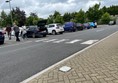 Image of vehicles parked in a crowded car park