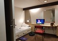 More of our accessible cabin on Stena Adventurer: second bed, telly and door to private accessible loo