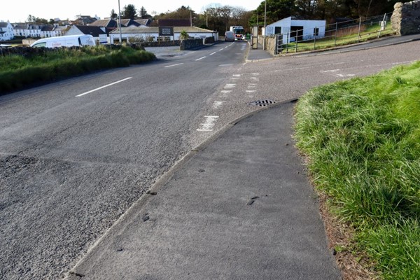 At the end of the pavement, there is still no dropped kerb.