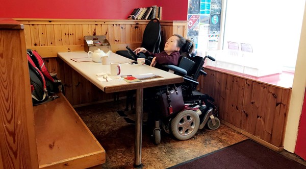 Image showing Claire sitting at the table at The Harbour Cafe.