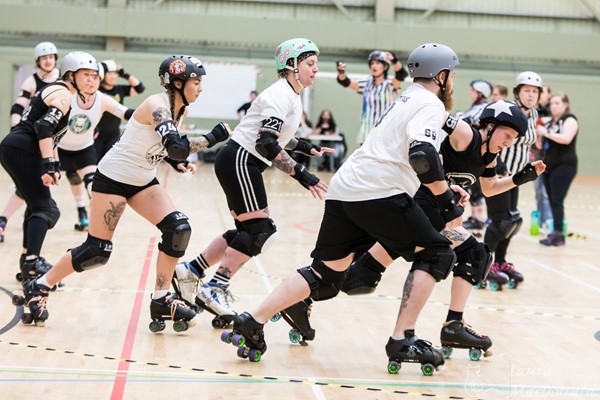 Image of people playing roller derby in the DISC main hall. Photo credit: Laura MacDonald