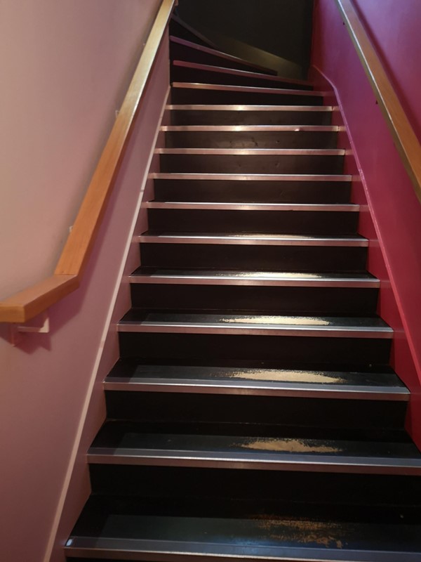 Stairs leading from the non accessible toilets back to the restaurant