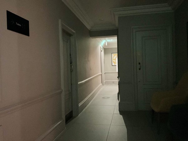 A dark hallway led to toilets