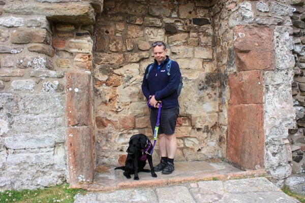 Hubby and assistance dog standing in a fireplace. They are both looking down and to one side, as though they have just thrown floo powder and are expecting to go somewhere. (Harry Potter reference)