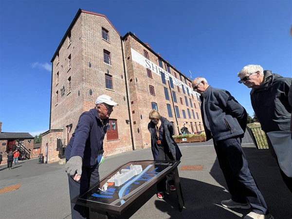 Image of people in front of a building