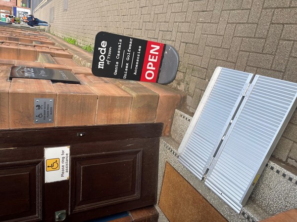 Portable metal ramp outside the shop