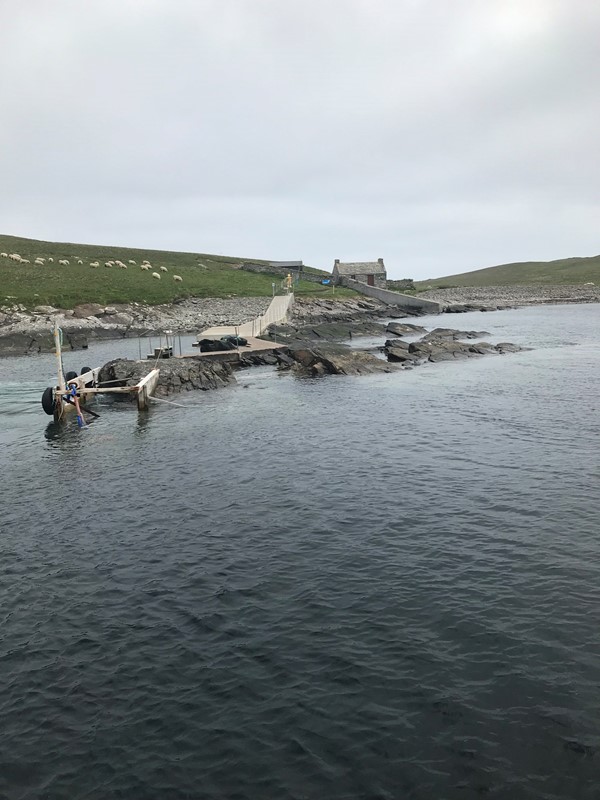 Looking towards the island of Mousa & the pier with poor accessibility to get ashore onto the islands the