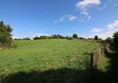 View looking up the hill from the car park to the doocot