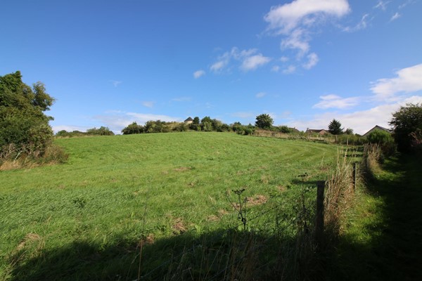 View looking up the hill from the car park to the doocot