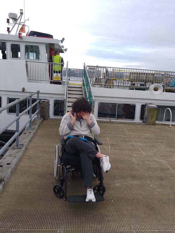 Image of a person in a wheelchair on a deck