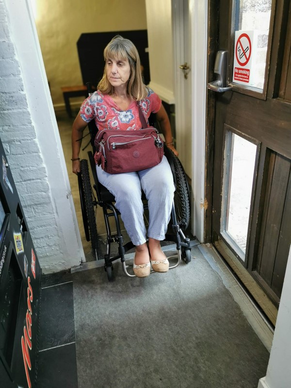 The narrow doorway in the communal lounge area. OK if someone is pushing you but not much room to put your hands to wheel yourself through.