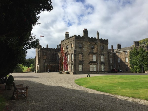 Level access, compacted gravel, benches and ramped castle entrance.