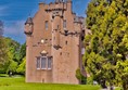 Crathes Castle from the entrance to the lower garden.