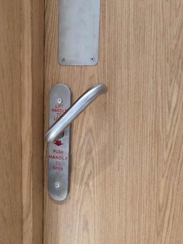 Image of door to accessible toilet from inside