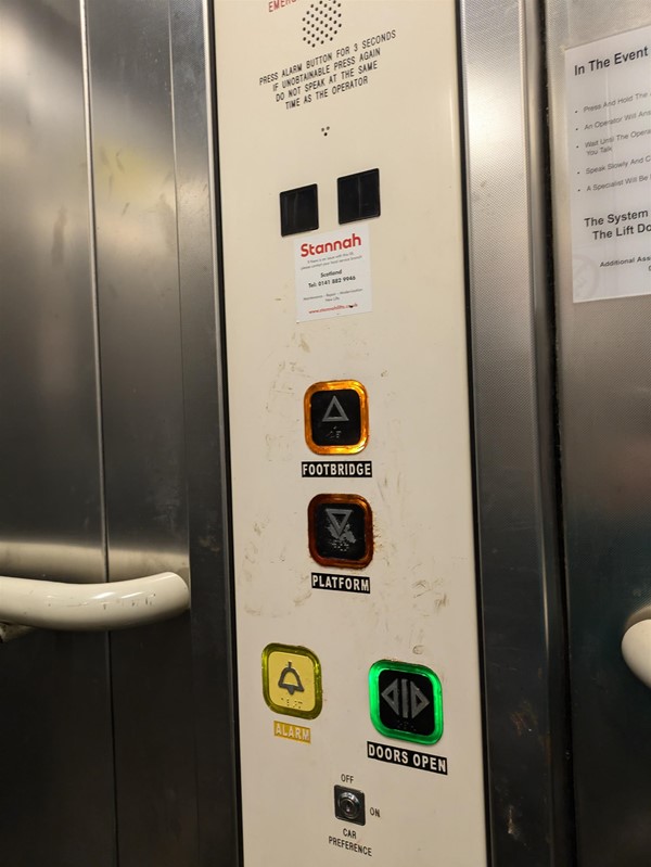 Image of lift buttons at Mount Florida Railway Station. The lift buttons have Braille Markings