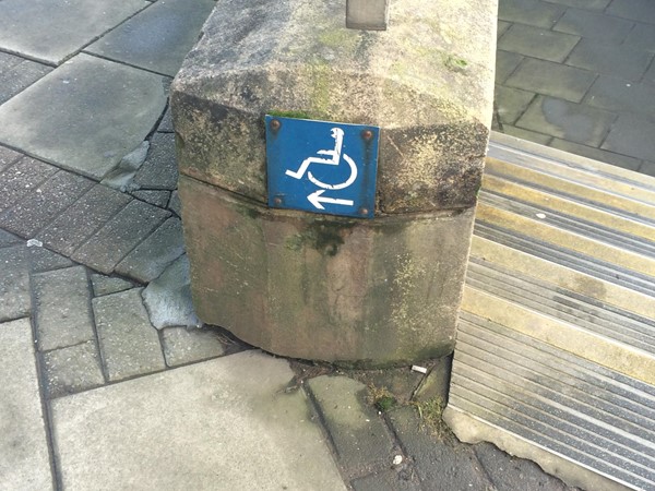 Signs directing to the accessible path to platform 2.