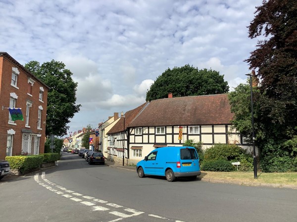 Street with a van and a house