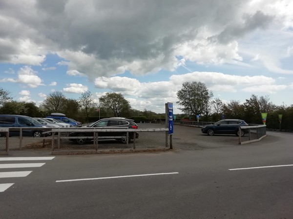 Disabled Parking Area. Attraction Entrance is at the tallest tree to the right, but barrier across length of roadway.