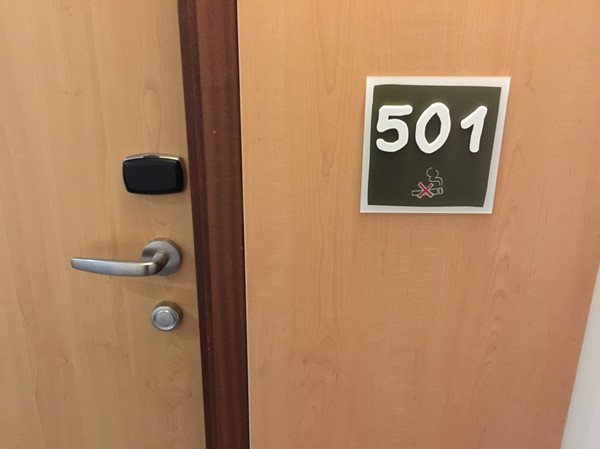 Large clear door numbers on the bedroom doors