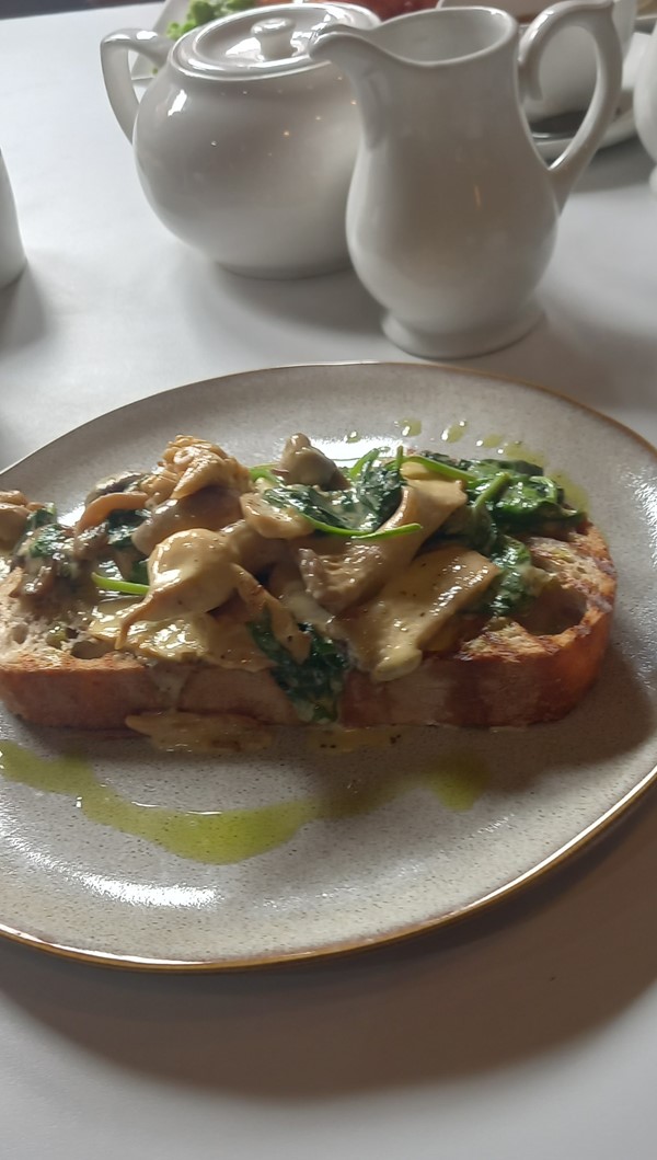 Wild mushrooms in garlic butter in the café for lunch.
