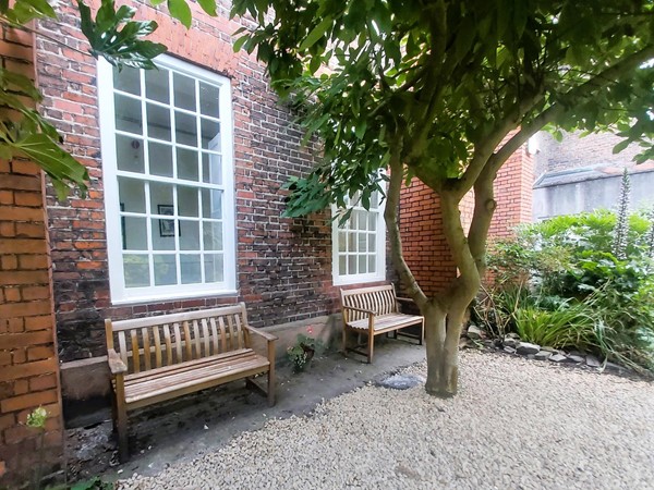 Image of a bench by a window