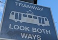 Image of a sign reading TRAMWAY LOOK BOTH WAYS