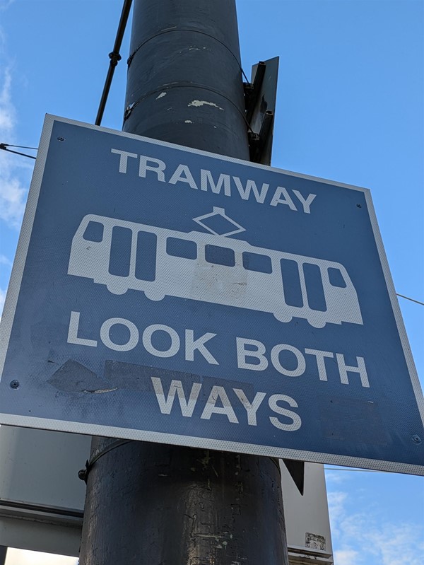 Image of a sign reading TRAMWAY LOOK BOTH WAYS