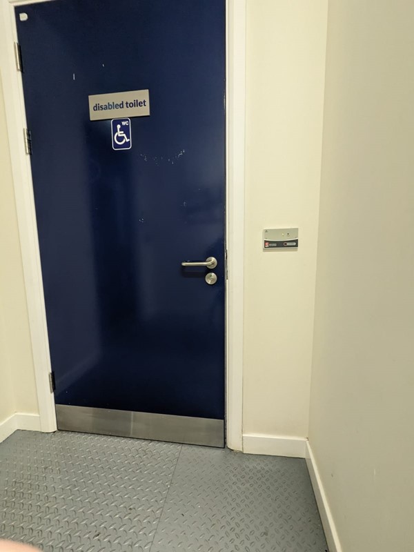 Image of an accessible toilet door