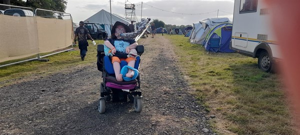 Image of a wheelchair user in a field