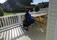 Wheelchair accessible picnic table on caravan decking.