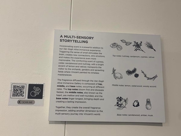 Information board about how the experience is multi-sensory, and a QR code which takes you to a BSL interpretation video