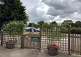 Wooden gate and warning sign