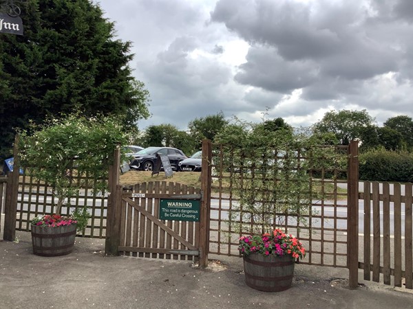 Wooden gate and warning sign