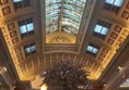 Image of a large ornate ceiling with a large window