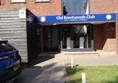 Image of a building with a blue sign