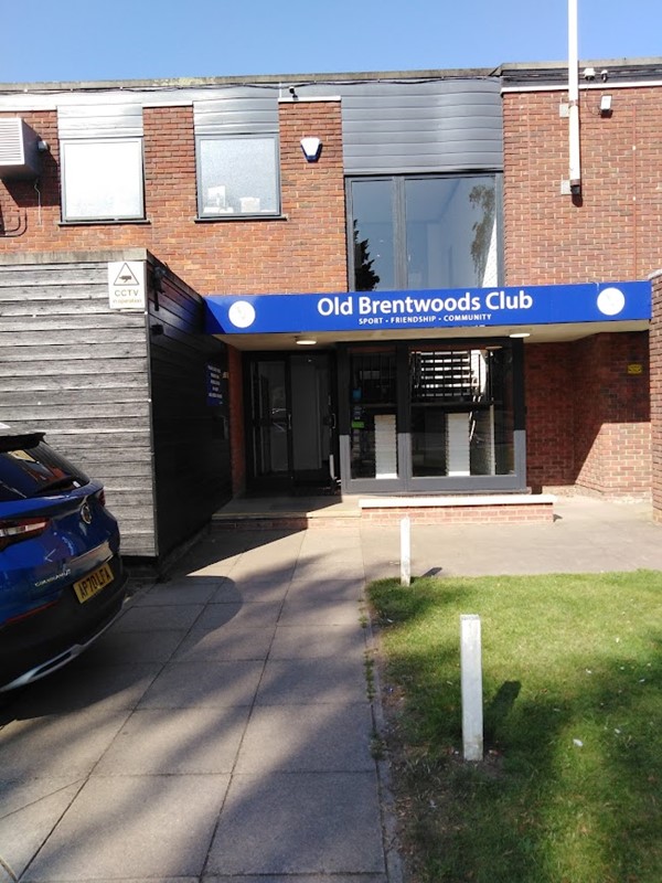 Image of a building with a blue sign