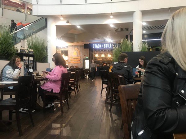 Image of some of the tables at the restaurant and showing how spacious the restaurant is.