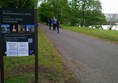 Picture of a sign by a pathway