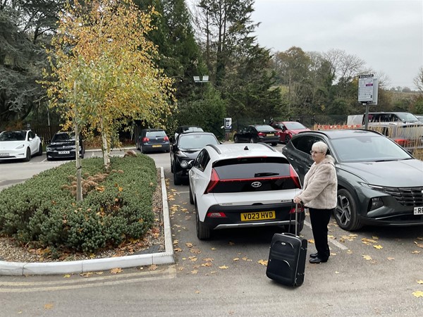 Image of a person in a car park