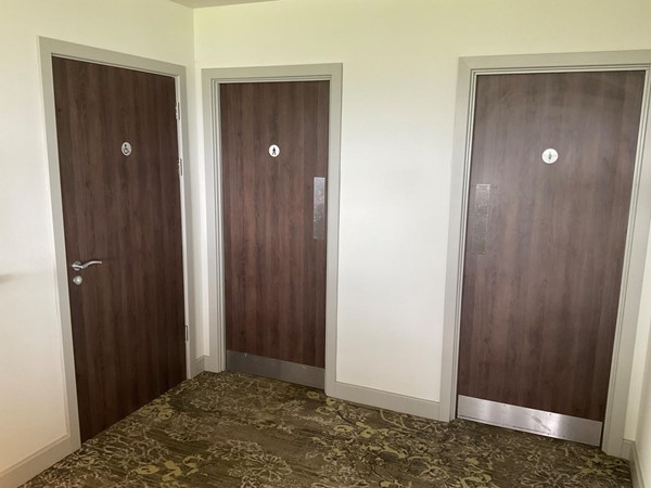 Image of a row of doors in a room