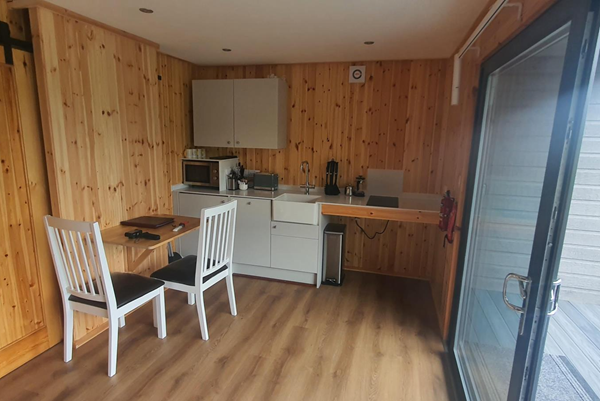 Image of the kitchen in the accessible glamping pod.