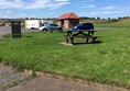 Picnic seats up on kerb.