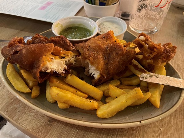 A thin layer of dried out haddock in an iron-tough batter