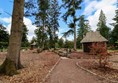 Gardens with marked paths which are wide and a hard dirt surface.